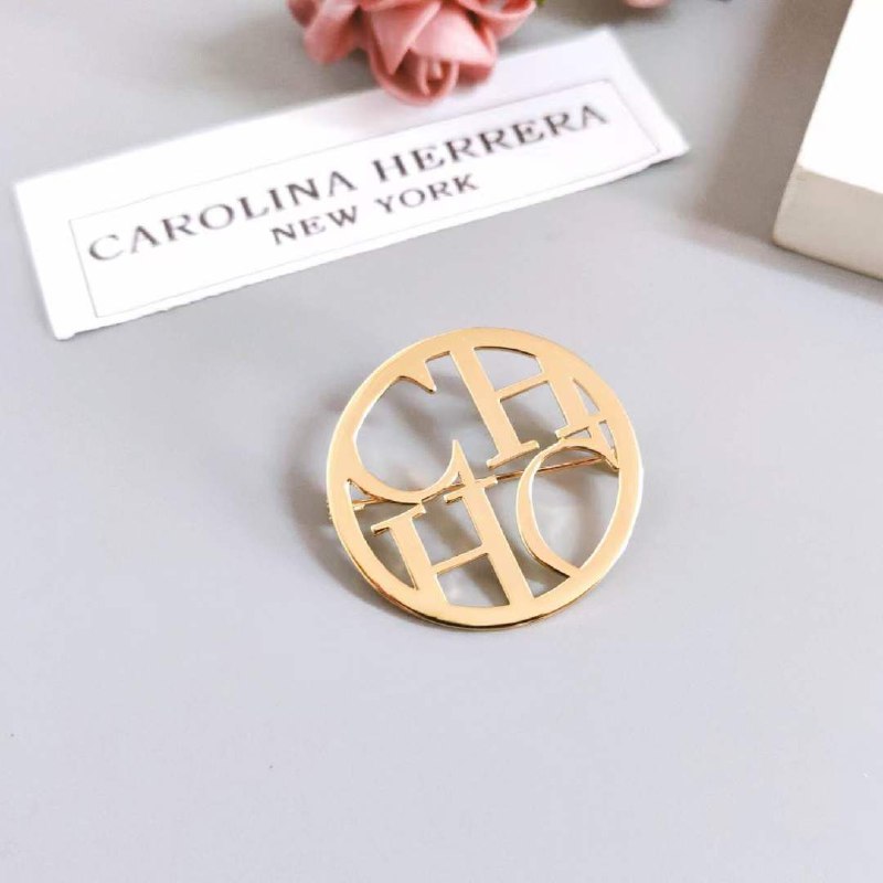 Broche acier CAROLINA HERRERA