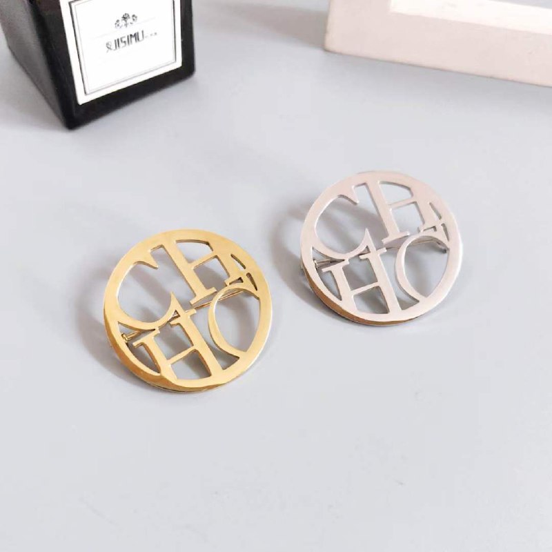 Broche acier CAROLINA HERRERA