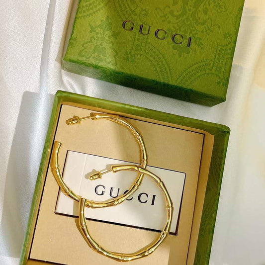 Boucles d'oreilles acier doré GUCCI
