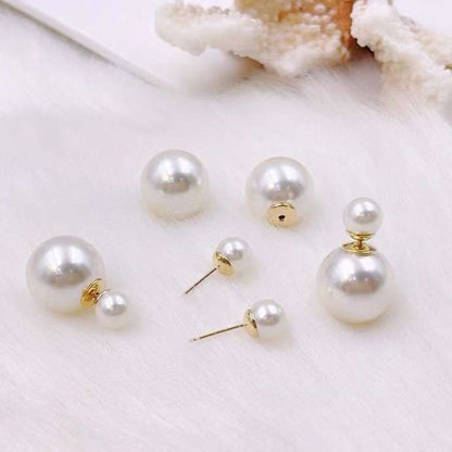 Boucles d'oreilles DIOR double perles