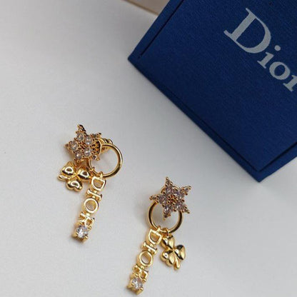 Boucles d'oreilles doré DIOR la star