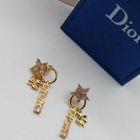Boucles d'oreilles doré DIOR la star