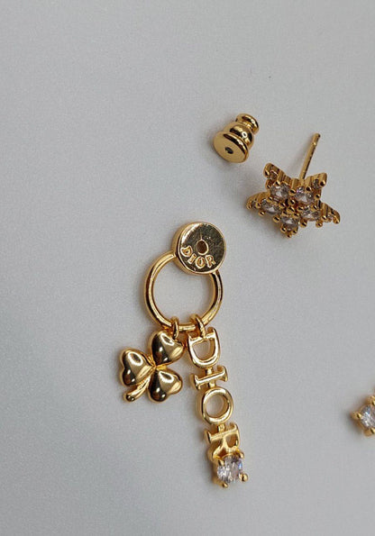 Boucles d'oreilles doré DIOR la star